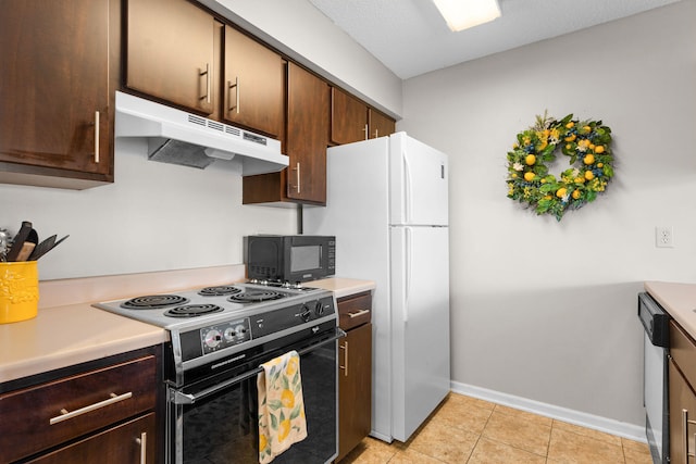 kitchen featuring dark brown cabinets, light tile patterned floors, black appliances, and a textured ceiling