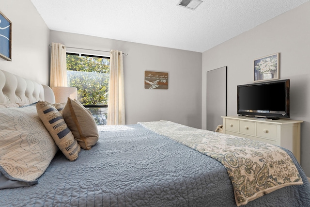 bedroom featuring a textured ceiling