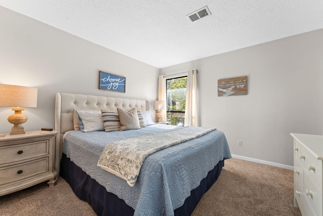 bedroom with lofted ceiling, light carpet, and a textured ceiling