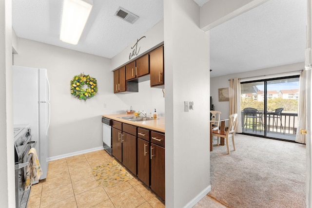 kitchen featuring light carpet, sink, stainless steel electric range oven, a textured ceiling, and black dishwasher