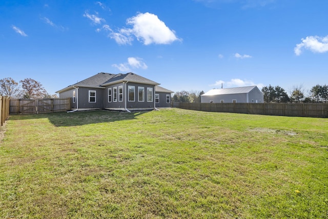 back of property featuring a lawn