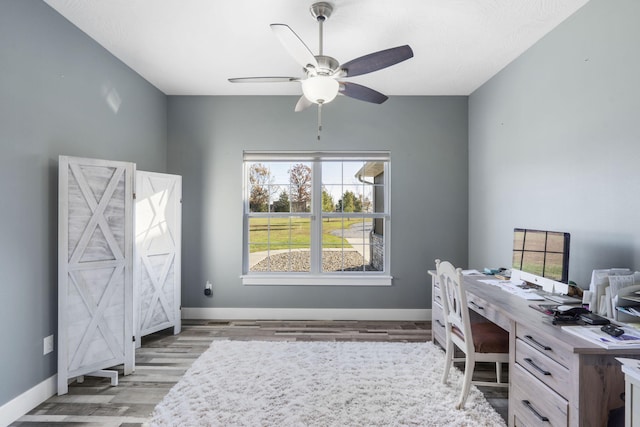 office area with ceiling fan and light wood-type flooring