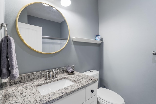 bathroom with vanity and toilet