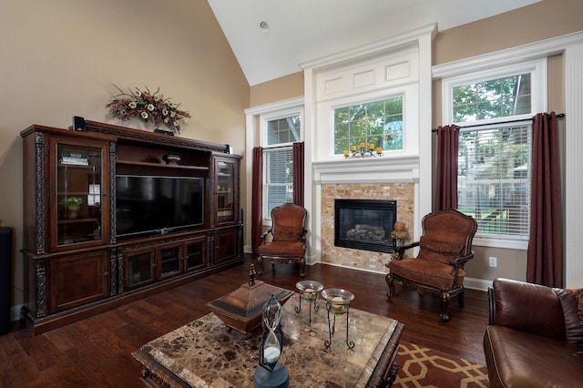 living room featuring a wealth of natural light, dark hardwood / wood-style flooring, and high vaulted ceiling