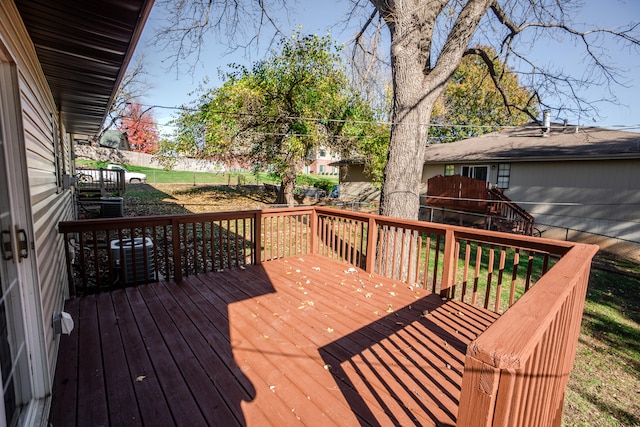 wooden terrace featuring central air condition unit