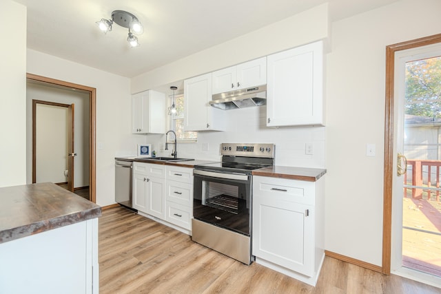 kitchen featuring white cabinets, stainless steel appliances, light hardwood / wood-style floors, and sink