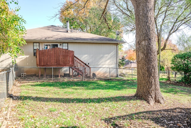 back of property with a lawn