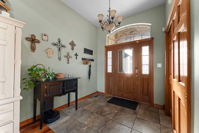 foyer entrance with an inviting chandelier