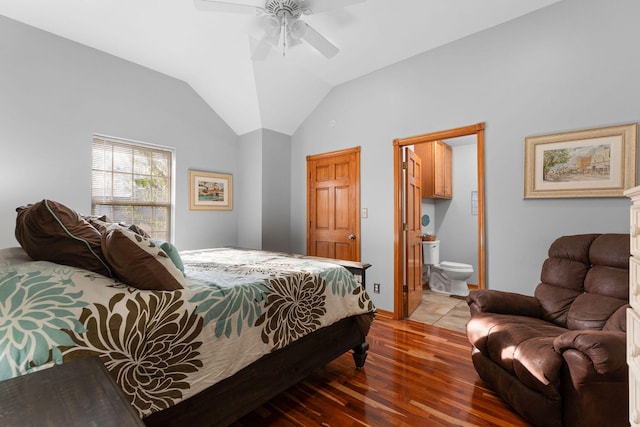 bedroom featuring ceiling fan, lofted ceiling, wood-type flooring, and ensuite bath