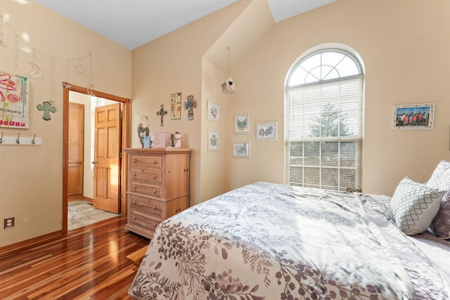 bedroom with hardwood / wood-style flooring