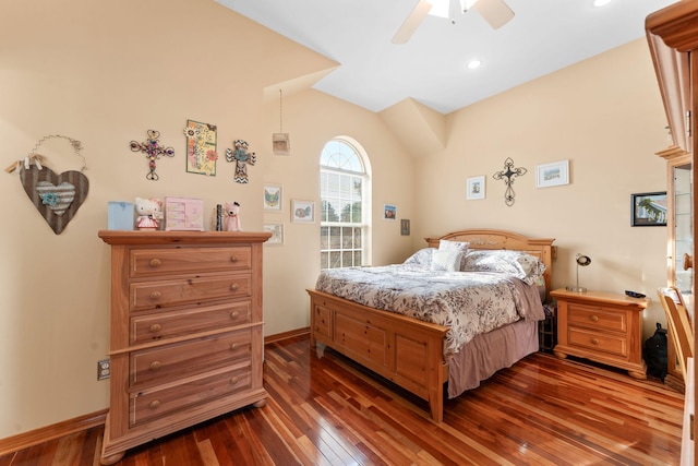 bedroom featuring dark hardwood / wood-style flooring, vaulted ceiling, and ceiling fan