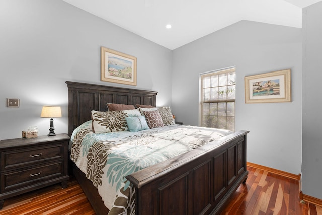 bedroom with dark wood-type flooring and vaulted ceiling