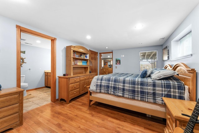117 Kingdom St, Cape Fair, MO 65624 - bedroom featuring light wood-type flooring, ensuite bathroom, and recessed lighting