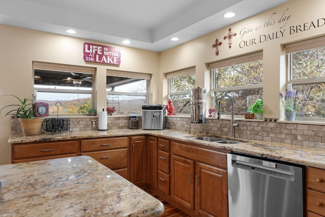 117 Kingdom St, Cape Fair, MO 65624 - kitchen featuring stainless steel dishwasher, a sink, brown cabinets, healthy amount of natural light, and recessed lighting