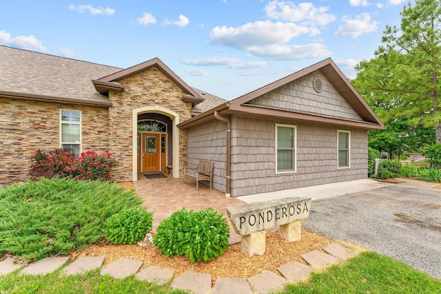 117 Kingdom St, Cape Fair, MO 65624 - view of front facade featuring stone siding and a shingled roof