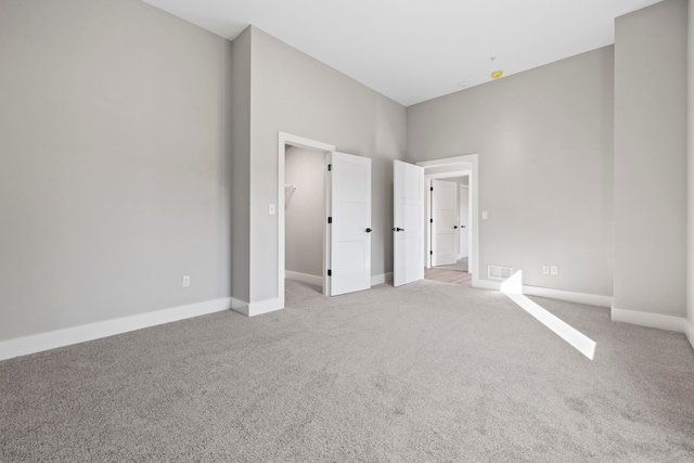 unfurnished bedroom featuring light colored carpet