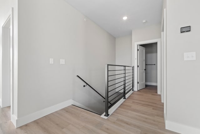 stairs with wood-type flooring