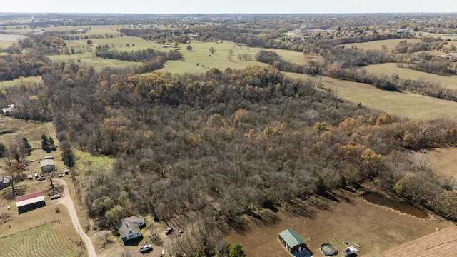 birds eye view of property featuring a rural view