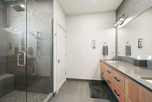 bathroom featuring vanity and a shower with shower door