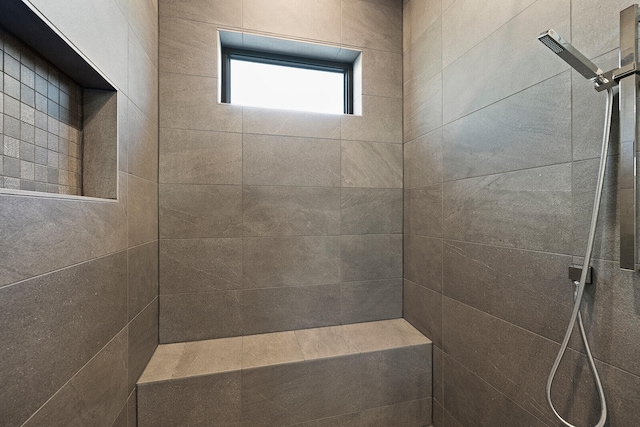 bathroom featuring tiled shower