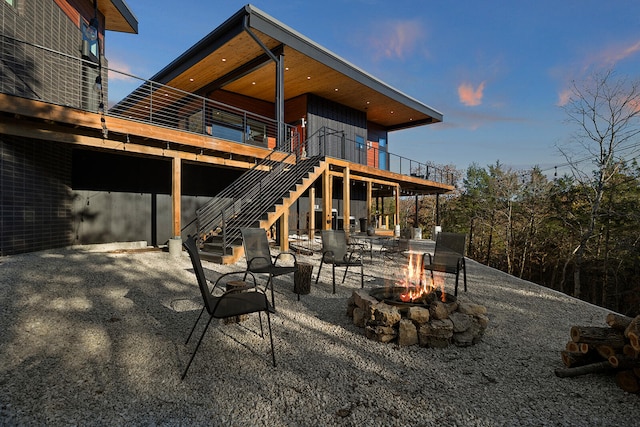 patio terrace at dusk with an outdoor fire pit