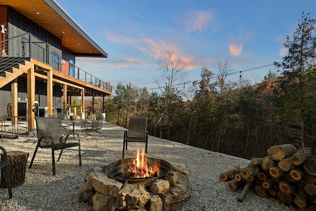 patio terrace at dusk with a fire pit