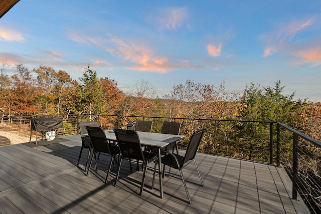 deck at dusk with grilling area