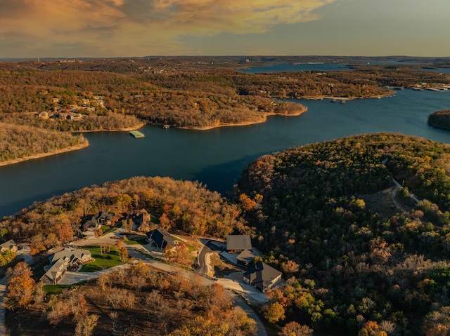 aerial view at dusk with a water view