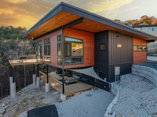 property exterior at dusk with a deck