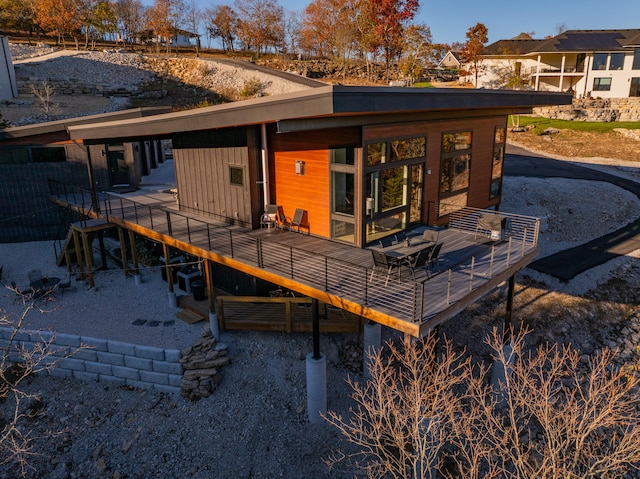 rear view of house with a wooden deck