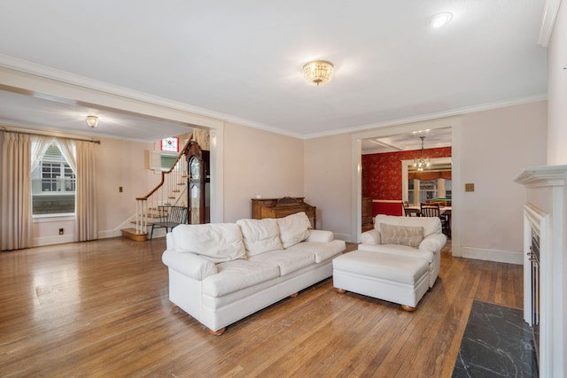 living room featuring hardwood / wood-style floors and ornamental molding