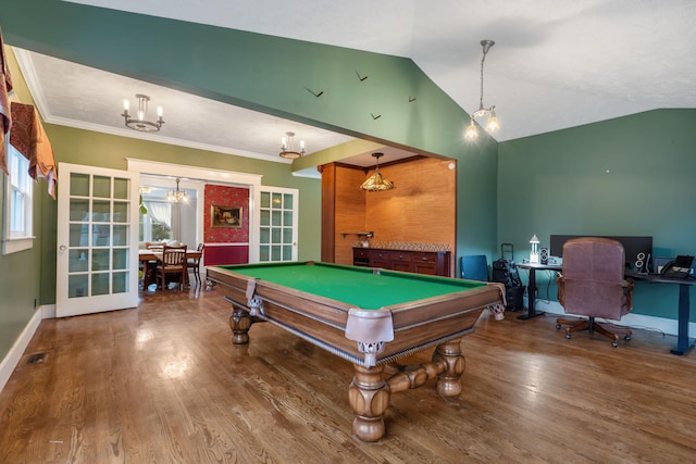 recreation room featuring french doors, billiards, crown molding, lofted ceiling, and hardwood / wood-style flooring