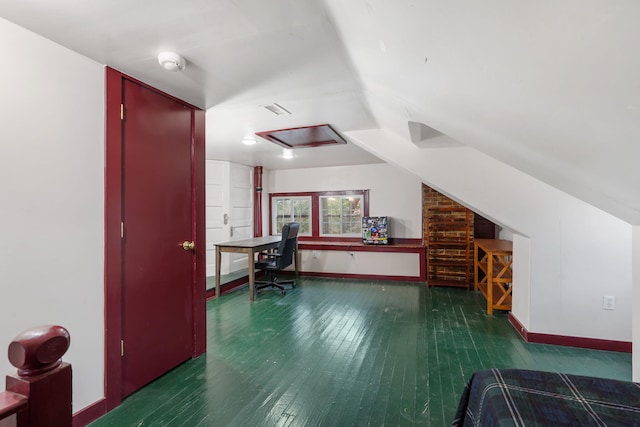 office space featuring dark hardwood / wood-style flooring and vaulted ceiling