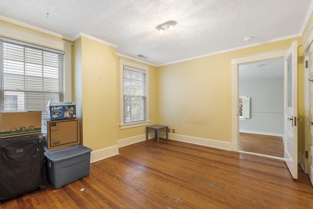 misc room featuring dark hardwood / wood-style floors, plenty of natural light, and a textured ceiling