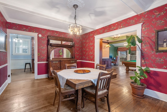 dining area featuring an inviting chandelier, beamed ceiling, billiards, crown molding, and hardwood / wood-style flooring