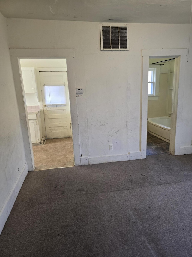 spare room with light colored carpet