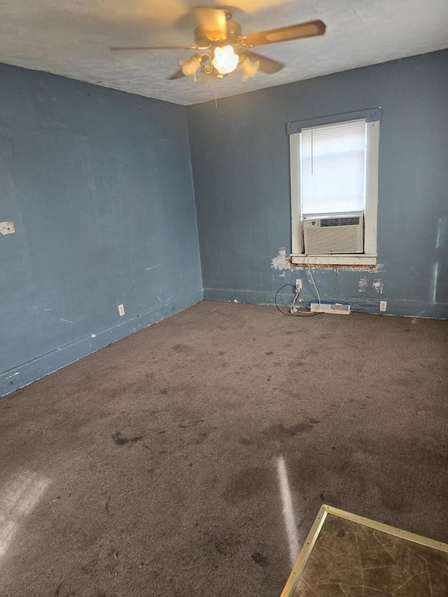 carpeted empty room featuring ceiling fan and cooling unit