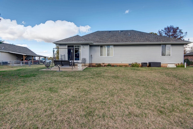 rear view of property with a lawn, a patio area, and central AC