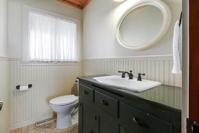 2112 Cambridge Dr, West Plains, MO 65775 - bathroom featuring wainscoting, toilet, and vanity