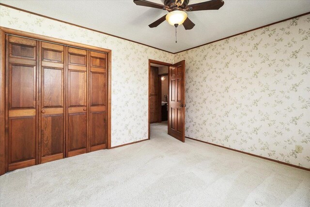 2112 Cambridge Dr, West Plains, MO 65775 - unfurnished bedroom featuring light carpet, baseboards, crown molding, and a ceiling fan