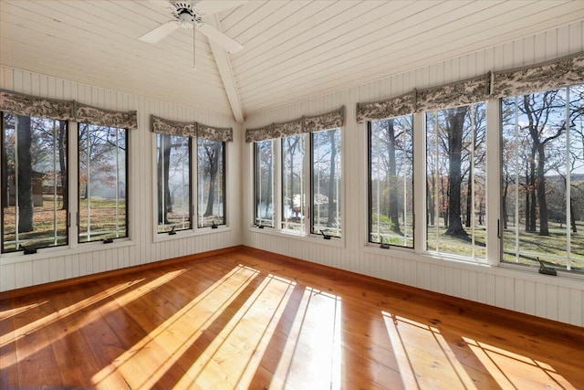 2112 Cambridge Dr, West Plains, MO 65775 - unfurnished sunroom with hardwood / wood-style flooring, lofted ceiling, healthy amount of natural light, wooden walls, and baseboards