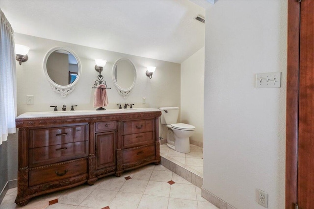2112 Cambridge Dr, West Plains, MO 65775 - full bath featuring toilet, double vanity, and tile patterned flooring
