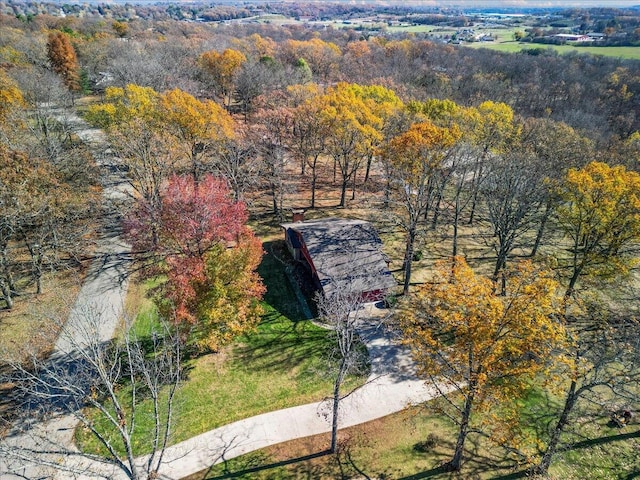 2112 Cambridge Dr, West Plains, MO 65775 - aerial view of property and surrounding area featuring a heavily wooded area
