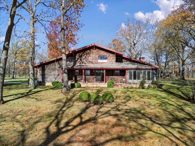 2112 Cambridge Dr, West Plains, MO 65775 - back of house with a lawn and a chimney