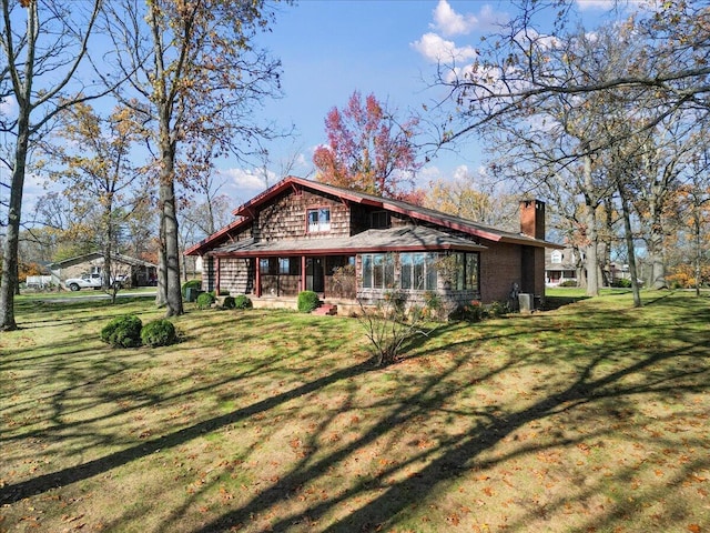 2112 Cambridge Dr, West Plains, MO 65775 - rear view of house featuring a chimney and a lawn