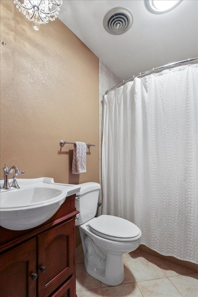 2112 Cambridge Dr, West Plains, MO 65775 - full bathroom with tile patterned floors, vanity, toilet, and a shower with curtain
