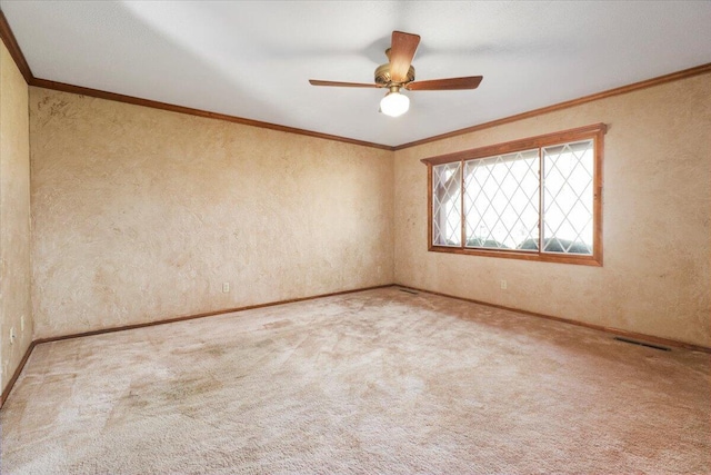 2112 Cambridge Dr, West Plains, MO 65775 - carpeted empty room with baseboards, a textured wall, ceiling fan, and crown molding