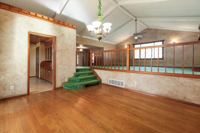 2112 Cambridge Dr, West Plains, MO 65775 - unfurnished room featuring wood finished floors, a chandelier, a ceiling fan, stairway, and baseboards
