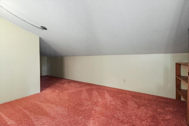 2112 Cambridge Dr, West Plains, MO 65775 - bonus room featuring carpet, a textured ceiling, and lofted ceiling