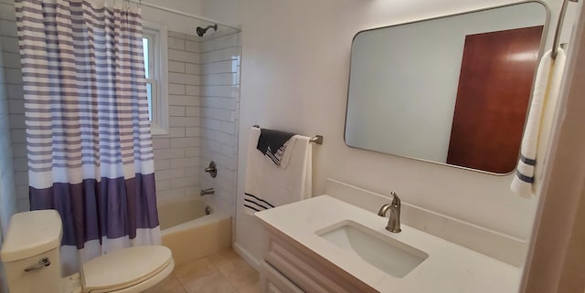 full bathroom with tile patterned flooring, shower / tub combo, vanity, and toilet